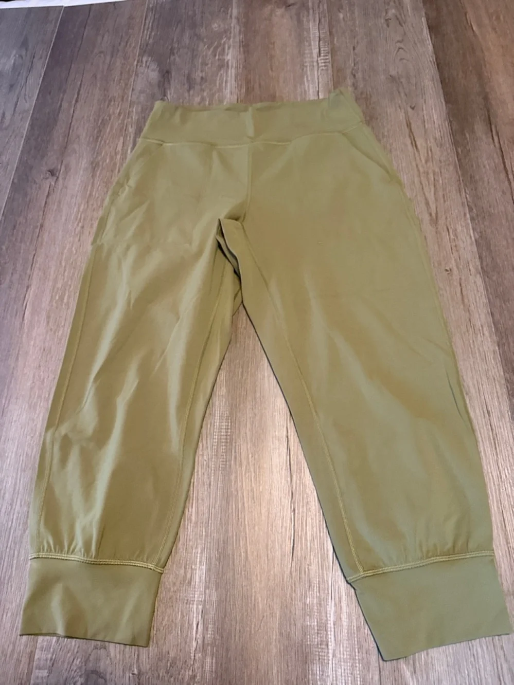 Lululemon Align High-Rise Cropped Jogger Capris in a bronze green color.